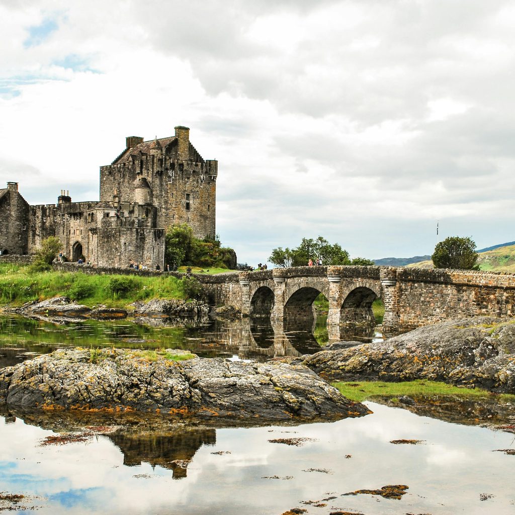 Explore the iconic Eilean Donan Castle and its scenic surroundings in the Scottish Highlands.