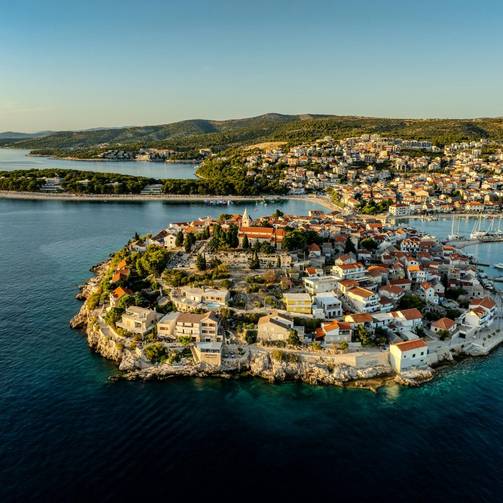 Stunning aerial view of Primošten peninsula and azure sea from above.
