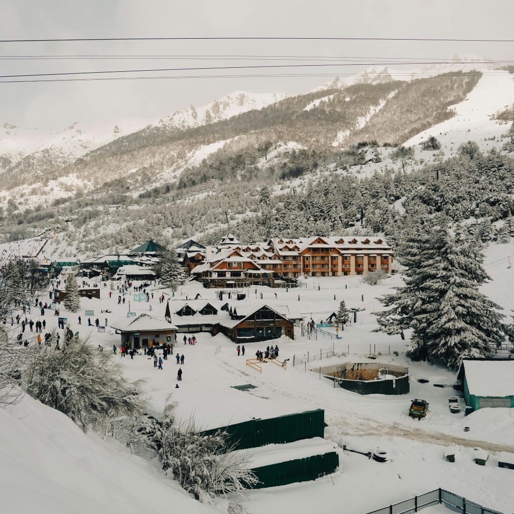 Panoramic view of a snowy ski resort in Bariloche, Argentina, during winter.